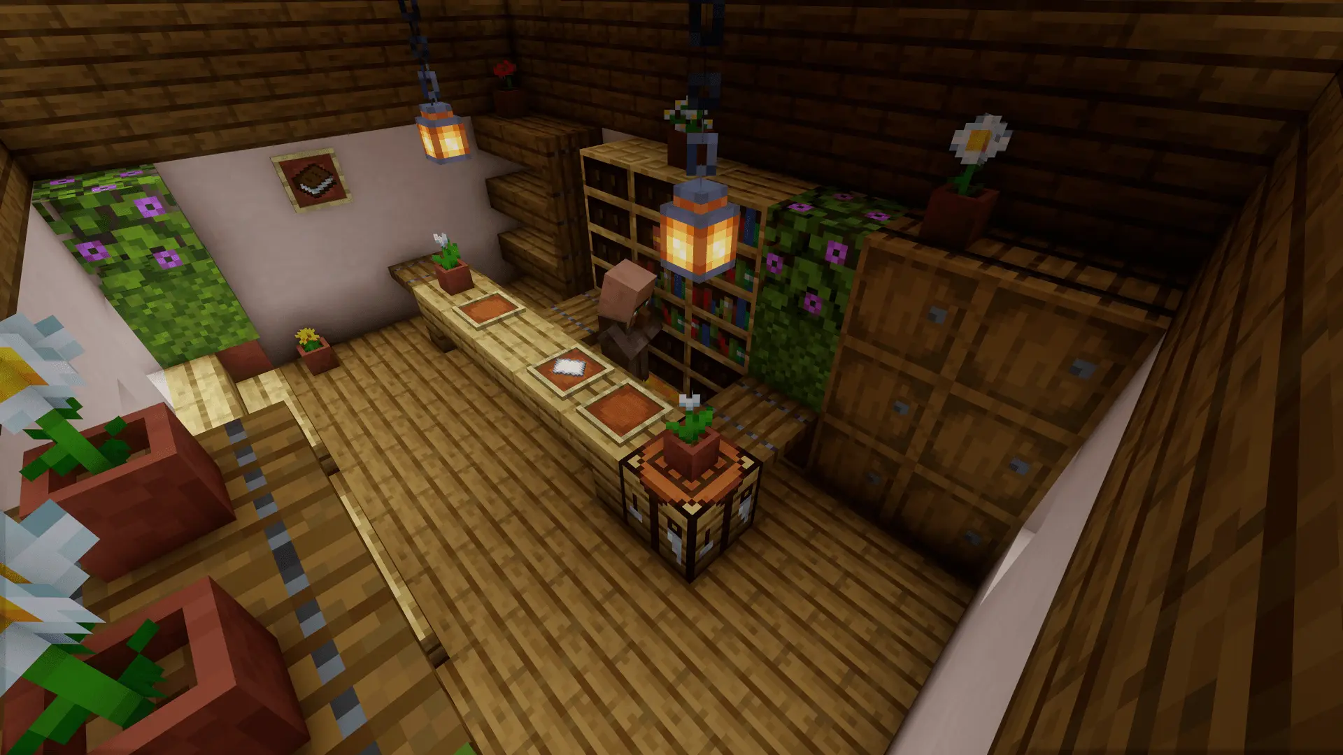 Inside the post office is the postman, currently sorting out letters and packages. There is an abundance of potted flowers and plants – he likes to look after them and they brighten up the place