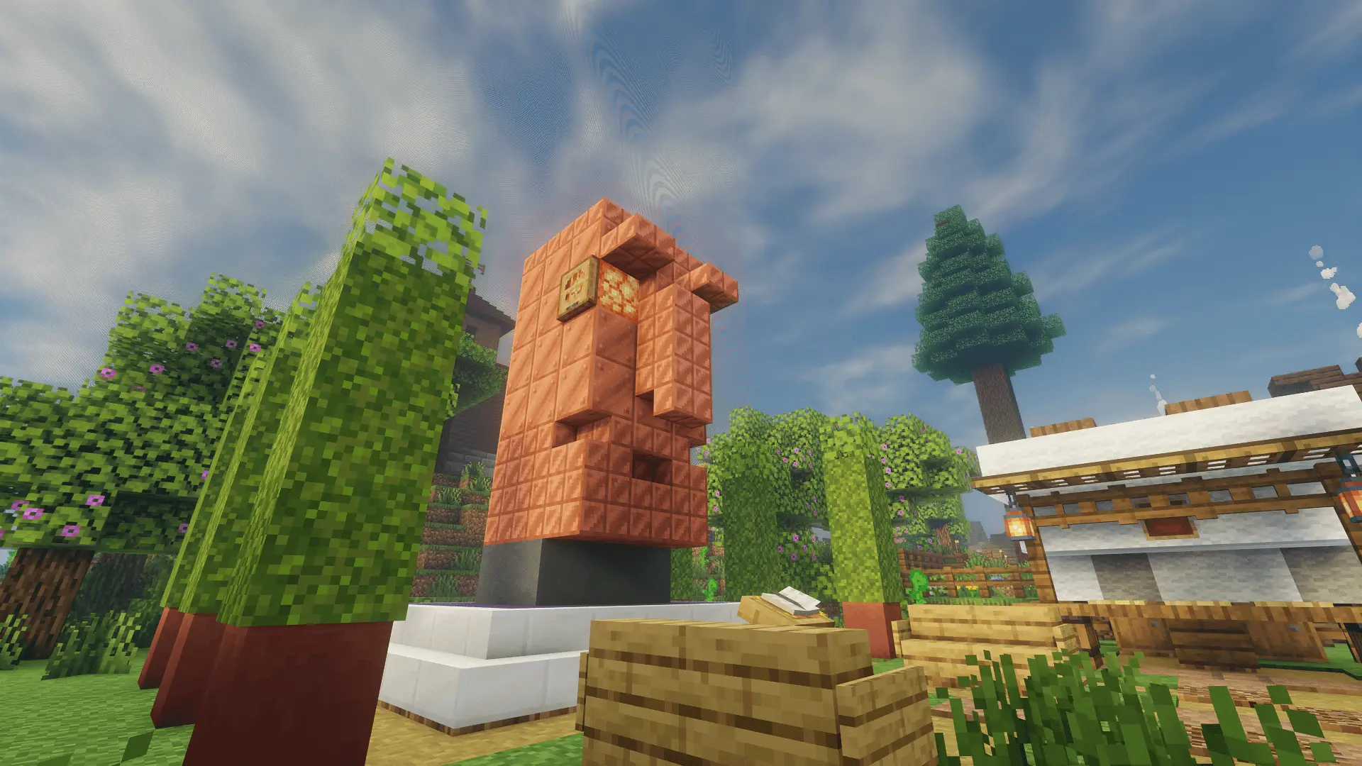 The copper monument sings its praise to the village’s founder